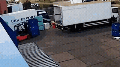 White Truck Urk-Export Parked In Lot GIF