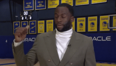 White Turtleneck Man By Oracle Sign On Basketball Court GIF