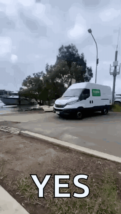 White Van Driving With Yes On Side GIF