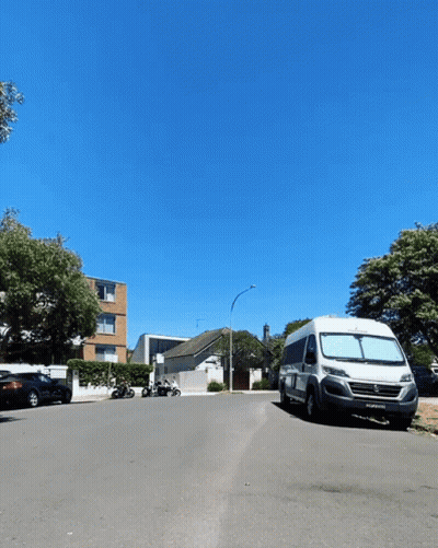 White Van Parked With ECW License Plate GIF