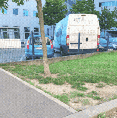 White Van With Art Parked Next To Blue Van GIF