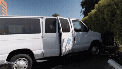 White Van With Number 47 Parked GIF