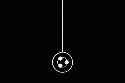 White Yo-Yo Hanging From String In Dark GIF