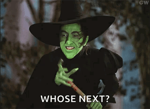 Wicked Witch From The Wizard Of Oz Holding A Bat And Asking Whose Next GIF