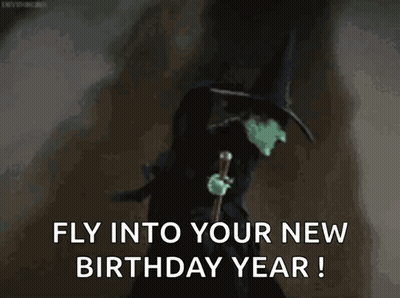 Bruja malvada de El Mago de Oz sosteniendo bastón diciendo Vuela hacia tu nuevo año de cumpleaños GIF