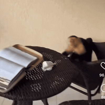 Wicker Table With Book And Number 96 GIF
