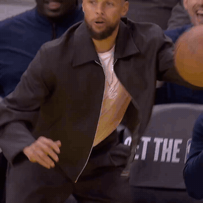 Wilson Basketball Held by Man in Crowd