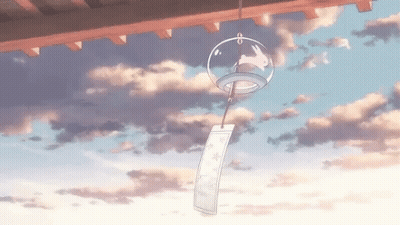 Wind Chime With Rabbit Hanging From Roof GIF