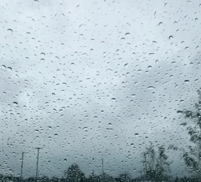 Window With Rain Drops And Cloudy Sky GIF