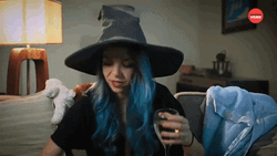 Wine Mom Wearing Sorting Hat GIF