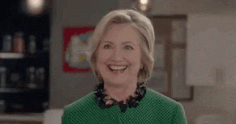 Winking Hillary Clinton In Green Blouse GIF