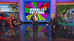 Winner Wheel Of Fortune Throwing Confetti GIF