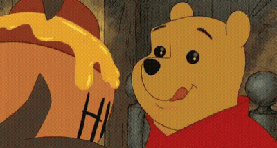 Winnie The Pooh Is Looking At A Pot Of Honey And Smiling GIF