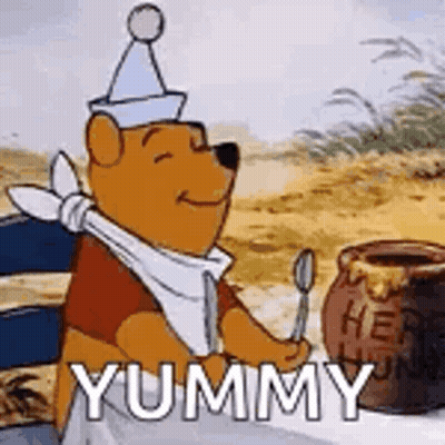 Winnie The Pooh Is Sitting At A Table With A Jar Of Honey And A Spoon In His Hand . GIF