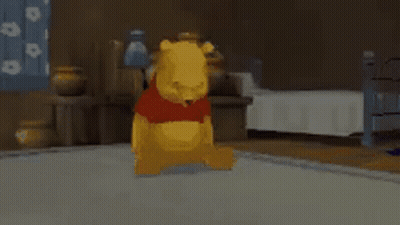 Winnie The Pooh Is Sitting On The Floor In A Bedroom . GIF