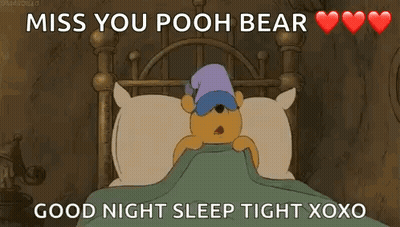 Winnie The Pooh Laying In Bed With Sleep Mask GIF