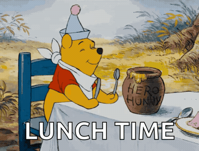 Winnie The Pooh Sitting At A Table With A Jar Of Honey GIF