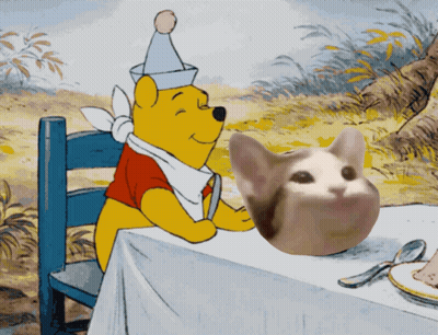 Winnie The Pooh Sitting At Table With Cat GIF