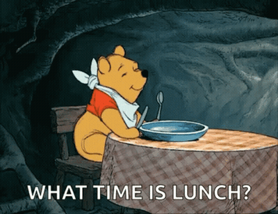 Winnie The Pooh Sitting At Table With Food Saying What Time Is Lunch GIF