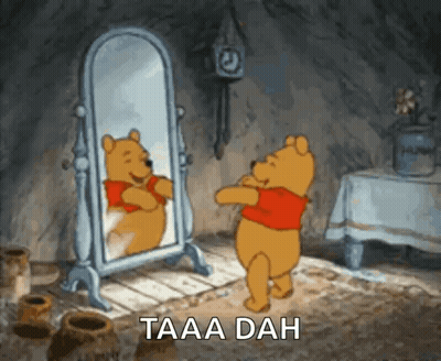 Winnie The Pooh Standing In Front Of Mirror Saying Taaa Dah GIF