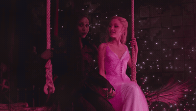 Witch And Princess Sitting On Swing GIF