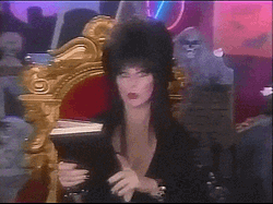 Witch Opening Book Of Spells GIF