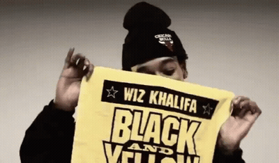 Wiz Khalifa Holding Yellow Towel Saying Black And Yellow GIF