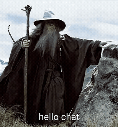 Wizard With Beard And Cane Standing On Rock Saying Hello Chat GIF