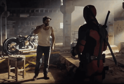 Wolverine And Deadpool Standing In Dark Room With Motorcycle GIF
