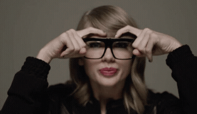 Woman Adjusting Glasses In Black Jacket GIF