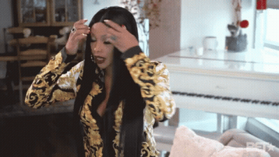 Woman Adjusting Hair At White Piano With BST GIF