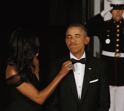 Woman Adjusting Man's Tie GIF