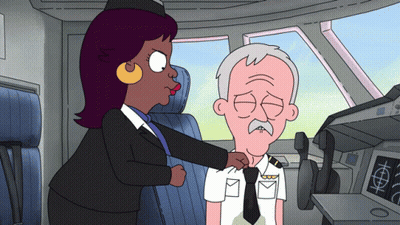 Woman Adjusting Man's Tie In Airplane GIF