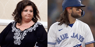 Woman And Blue Jays Baseball Player Sitting Together GIF