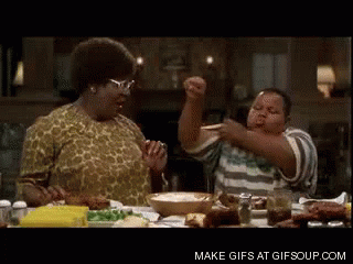 Woman And Boy Eating And Dancing At Table GIF