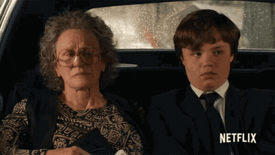 Woman And Boy Sitting In Car With Netflix GIF