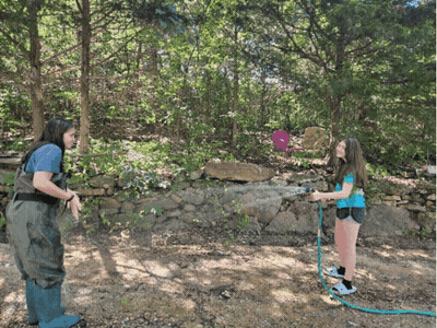 Woman And Girl Playing With Hose GIF