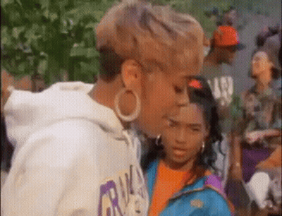 Woman And Girl Standing In Front Of Crowd GIF