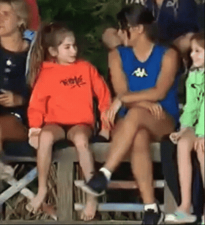 Woman And Little Girl Sitting On Bleacher GIF