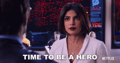 Woman And Man At Screen Saying Time To Be Hero GIF