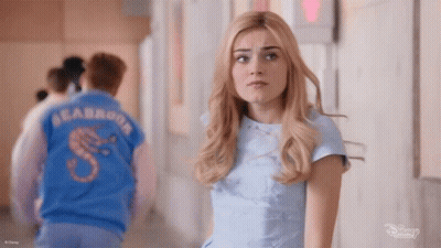 Woman And Man In Blue Shirts In Hallway GIF