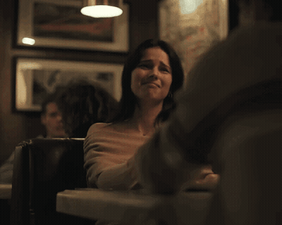 Woman And Man Sitting At Restaurant Table GIF