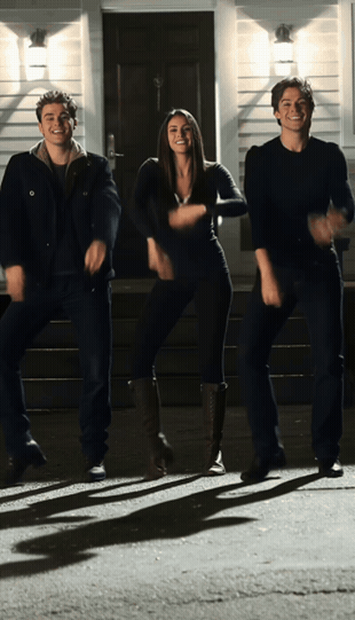 Woman And Two Men Dancing In Front Of House GIF