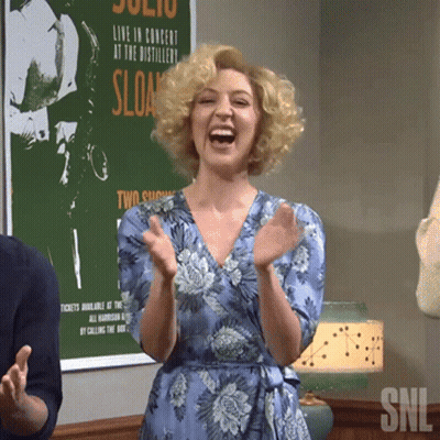 Woman Applauding In Front Of Sloan Poster GIF