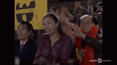 Woman Applauds Holding Ep Sign GIF