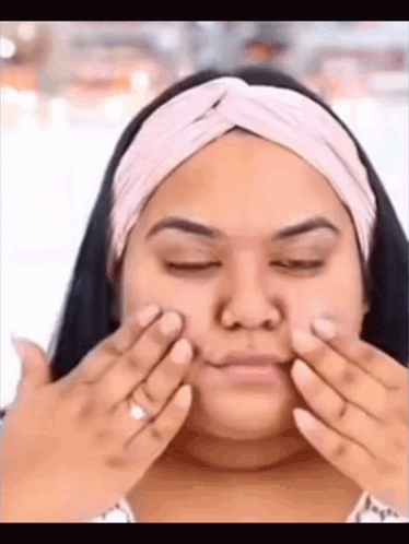 Woman Applying Cream To Face GIF
