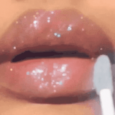 Woman Applying Lip Gloss GIF