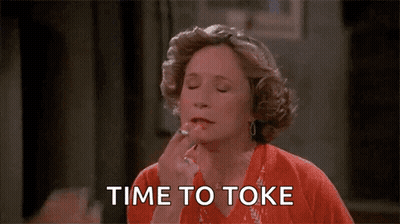 Woman Applying Lipstick Man Saying Time To Toke GIF