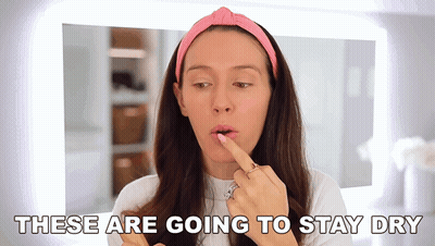 Woman Applying Lipstick Saying These Are Going To Stay Dry GIF