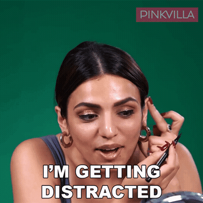Woman Applying Makeup Saying I'm Getting Distracted GIF